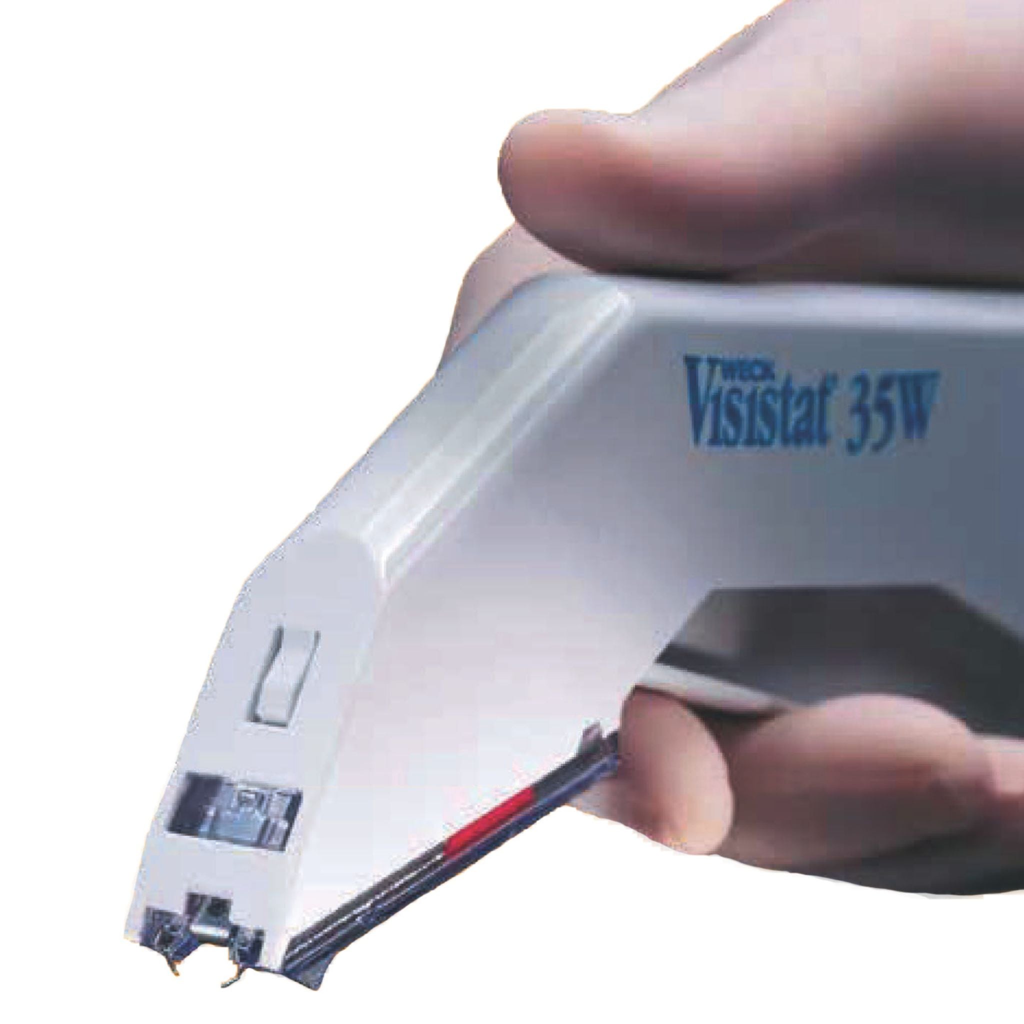 Hand holding skin stapler